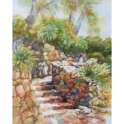 Sunlit rock steps ascending to a pathway with colorful rock walls, green vegetation, trees and a lady walking with a pink hat.