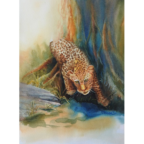 Watercolor painting of a leopard in front of a large tree getting ready to take a drink of water in blues, browns and gold. 